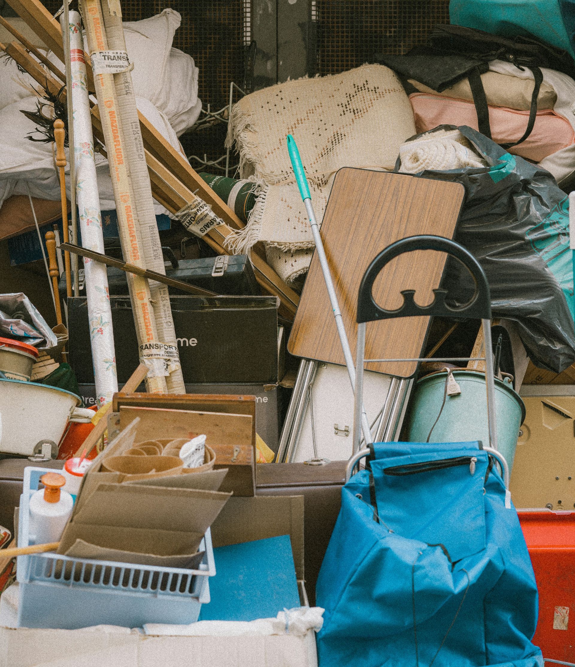 a pile of junk sitting outside of a building